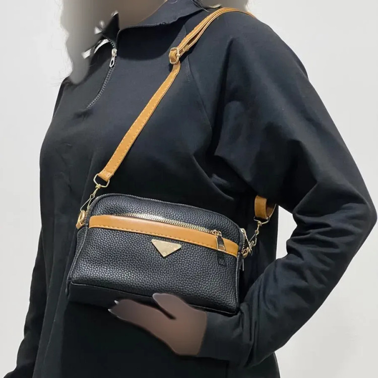 کیف دستی و دوشی پاسپورتی زنانه چرم مصنوعی با 4 زیپ و بند مچی و بلند کد 1389